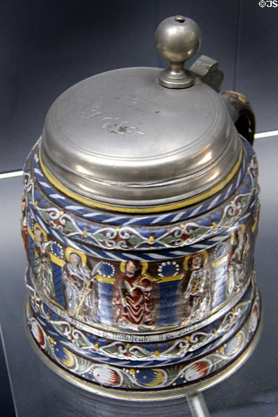 Stoneware Apostle tankard (1692) with molded decoration added bearing names of 11 Apostles from Creusen at Deutsches Museum. Munich, Germany.