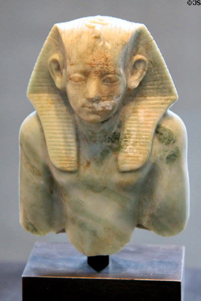 Upper half of seated figure of Pharaoh Amenemhat III of limestone (12th Dynasty - c1880 BCE) from Fayum? at Museum Ägyptischer Kunst. Munich, Germany.