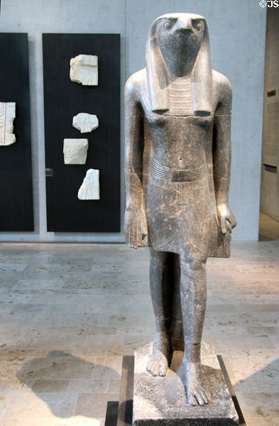 Striding figure of god Horus of granite (18th Dynasty - c1360 BCE) from West Thebes at Museum Ägyptischer Kunst. Munich, Germany.