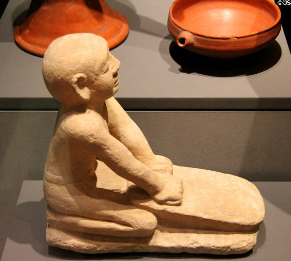 Figure of servant grinding flour of Limestone (6th Dynasty - c2250 BCE) at Museum Ägyptischer Kunst. Munich, Germany.