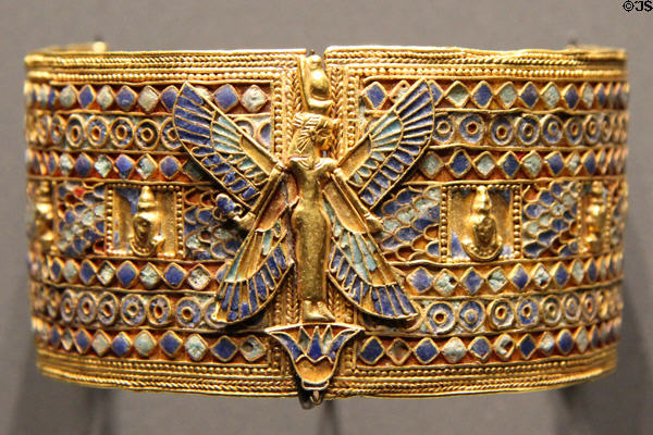 Armband with standing goddess of gold & glass at Museum Ägyptischer Kunst. Munich, Germany.