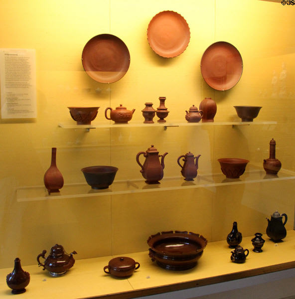 Examples of red stoneware (Böttgersteinzeug) discovered (1707) by alchemist Johann Friedrich Böttger produced in Meissen at Meissen porcelain museum at Lustheim Palace. Munich, Germany.