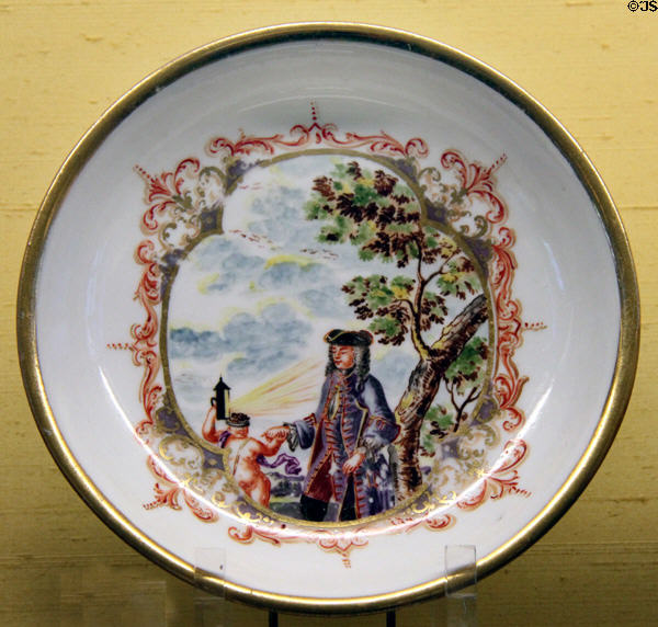 Meissen porcelain plate painted with brightly colored enamel (c1723) by Johann Gregorius Höroldt at Meissen porcelain museum at Lustheim Palace. Munich, Germany.
