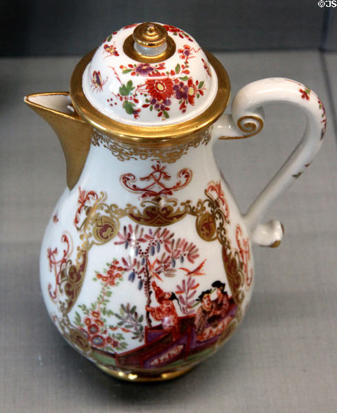 Meissen porcelain chinoiserie coffee pot with gilded surfaces (c1722) at Meissen porcelain museum at Lustheim Palace. Munich, Germany.
