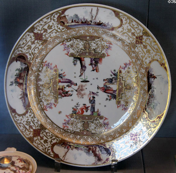 Meissen porcelain plate with Chinese & landscape scenes in cartouches (c1730-5) by Johann Gregorius Höroldt at Meissen porcelain museum at Lustheim Palace. Munich, Germany.