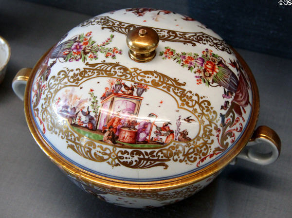Meissen porcelain chinoiserie lidded terrine accentuated with gold luster frames (c1735) at Meissen porcelain museum at Lustheim Palace. Munich, Germany.