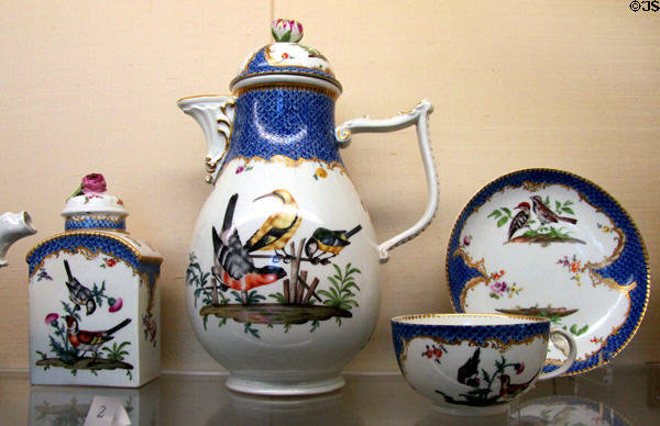 Meissen porcelain coffee service painted with birds with rococo blue mosaic scale decoration (c1760-70) at Meissen porcelain museum at Lustheim Palace. Munich, Germany.