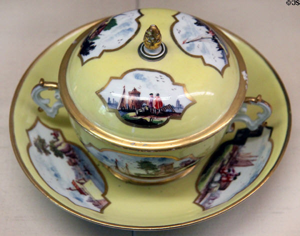 Meissen porcelain yellow small terrine (c1740-5) painted with European scenes at Meissen porcelain museum at Lustheim Palace. Munich, Germany.