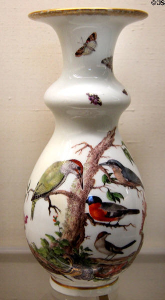 Meissen porcelain white vase (c1745) painted with birds & insects at Meissen porcelain museum at Lustheim Palace. Munich, Germany.