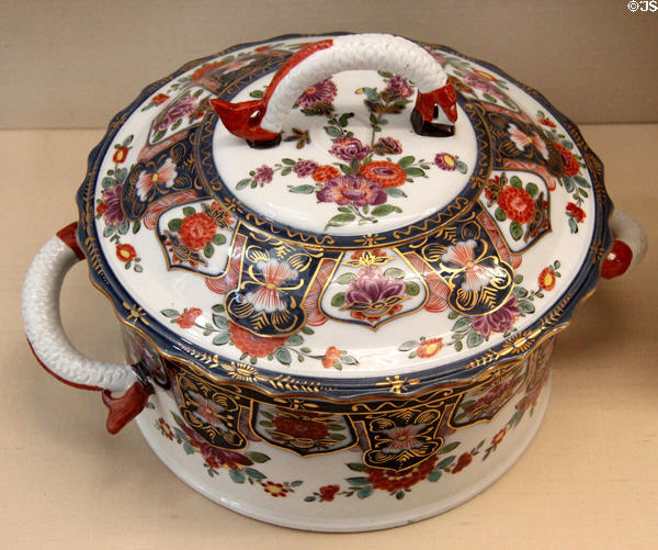 Meissen porcelain terrine (c1730) with fish handles, lambrequin decor & Indian flowers at Meissen porcelain museum at Lustheim Palace. Munich, Germany.