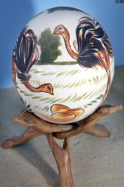 Painted ostrich egg on tripod stand at folk art Collection Gertrud Weinhold. Munich, Germany.