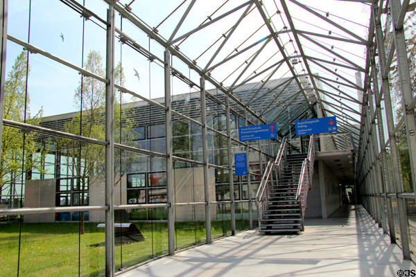 Covered glass walkway leading to Deutsches Museum Flugwerft Schleissheim entrance. Munich, Germany.