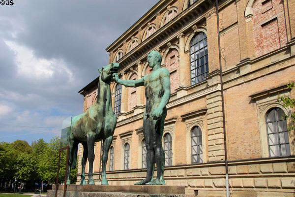 The Horse Tamer bronze sculpture (1925-1930) by Herrmann Hahn damaged in WW II beside Alte Pinakothek. Munich, Germany.