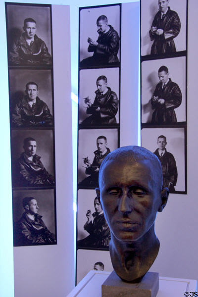 Bertolt Brecht bronze bust (1930) by Paul Hamann with Brecht photos behind at Brechthaus Museum. Augsburg, Germany.