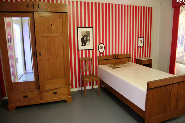 Bedroom of Bertolt Brecht's mother with sturdy wooden furniture at Brechthaus Museum. Augsburg, Germany.