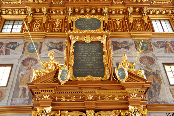 Ornate doorway with framed text set into pediment in Goldener Saal at Augsburg Rathaus. Augsburg, Germany.