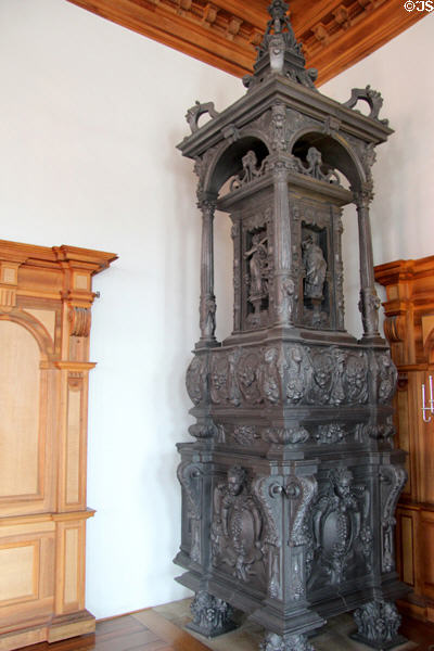 Antique cast iron room-heating stove at Augsburg Rathaus. Augsburg, Germany.