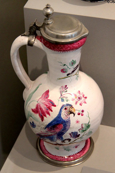 Faience narrow necked, lidded jug with parrot, insects & flowers (c1730) painted by Bartholomäus Seutter from Augsburg at Maximilian Museum. Augsburg, Germany.