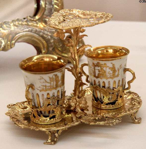Meissen porcelain chocolate service with highly decorative gold plated tray (1769-71) by goldsmith Johann Jakob Adam from Augsburg at Maximilian Museum. Augsburg, Germany.