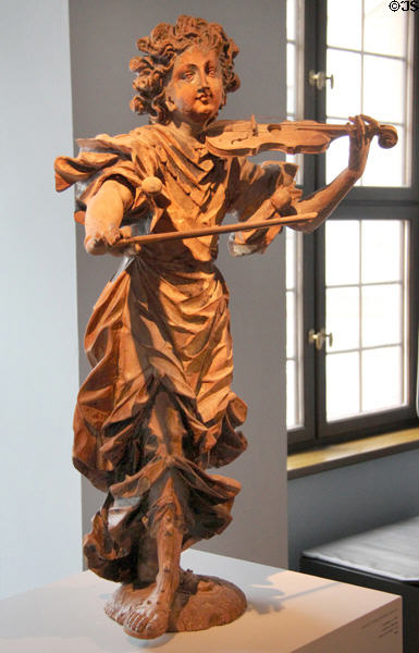 Violin playing angel statue (c1690) by Lorenz Luidl from Landsberg at Maximilian Museum. Augsburg, Germany.