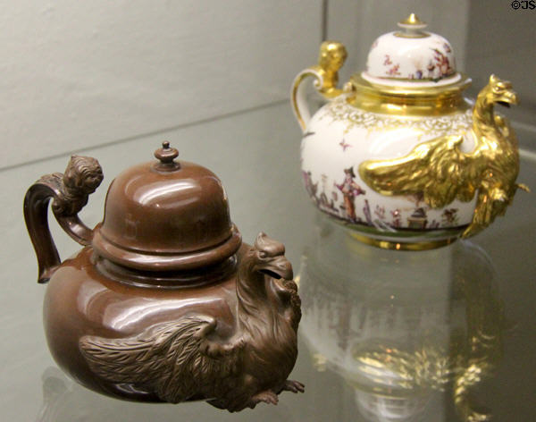 Meissen eagle teapots by Johann Jacob Irminger in brown stoneware (c1710) & porcelain painted with Chinese scenes (c1730) at Bamberg Old Town Hall Museum of Faience & Porcelain. Bamberg, Germany.