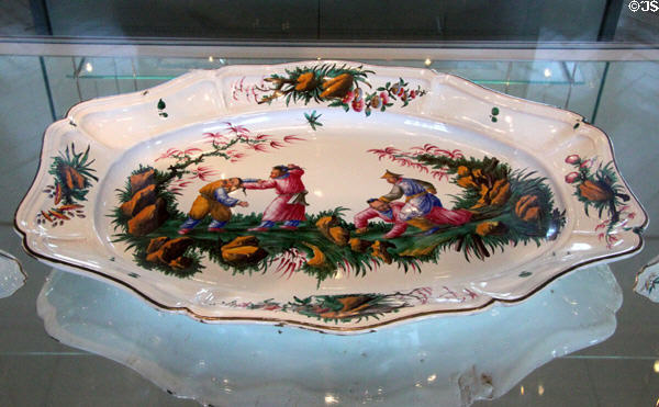 Faience plate with battling Chinese (c1765-70) by Joseph Hannong of Strasbourg, France at Bamberg Old Town Hall Museum of Faience & Porcelain. Bamberg, Germany.