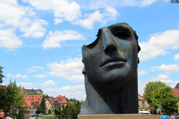 Sculpted Roman centurion partial head inspired by Pompeii (1987) by Igor Mitoraj on bank of Regnitz River. Bamberg, Germany.