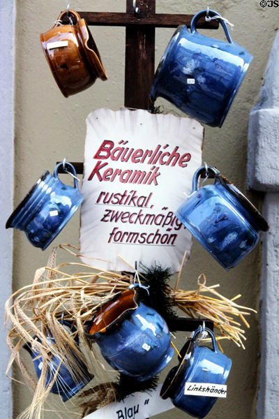 Shop displaying rustic ceramic pitchers. Bamberg, Germany.