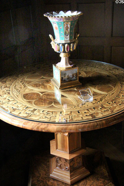 Neo-Gothic table on hexagonal pedestal (c1850-5) attrib. Wilhelm Puff from Coburg holding porcelain vase (latter 19thC) from Thuringia at Coburg Castle. Coburg, Germany.