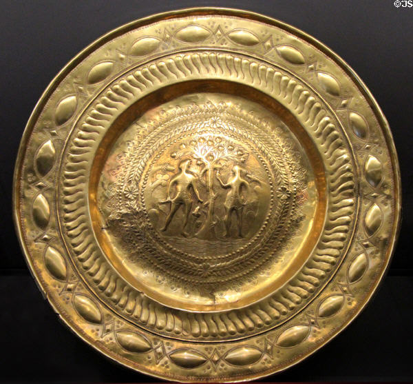 Brass baptismal font with relief of Adam & Eve in Paradise (c1500) at Coburg Castle. Coburg, Germany.