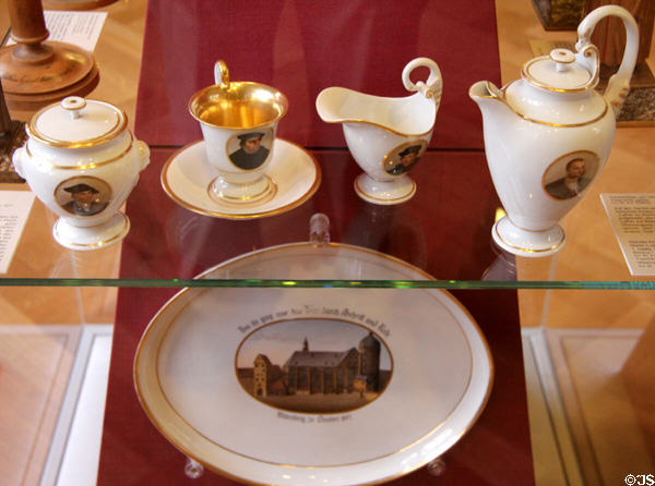 Porcelain coffee set celebrating 300 anniversary of Reformation painted with portraits of Martin Luther (1817) by KPM Berlin at Coburg Castle. Coburg, Germany.