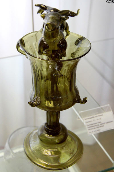 Green blown trick glass with stag siphon (17th-18thC) from Germany at Coburg Castle. Coburg, Germany.