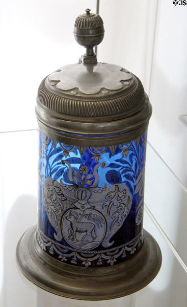 Covered blue glass krug with enameled lamb of god (1st half 18thC) from Thuringia? at Coburg Castle. Coburg, Germany.