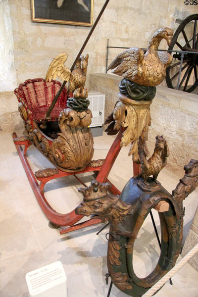 Carved horse-drawn racing snow sled with Pelican (c1700) theme at Coburg Castle. Coburg, Germany.