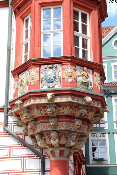 Artistic painting detail on octagonal oriel window of Coburg Stadthaus. Coburg, Germany.