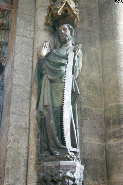 Carving of St Simon with saw symbol at St Sebaldus Church. Nuremberg, Germany.
