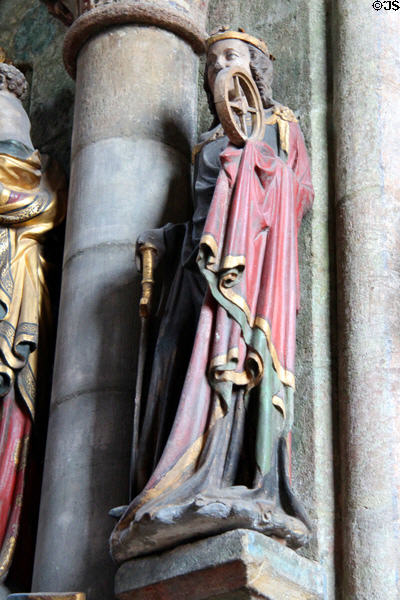 Carving of St Catherine of Alexandria with wheel & sword symbols at St Sebaldus Church. Nuremberg, Germany.