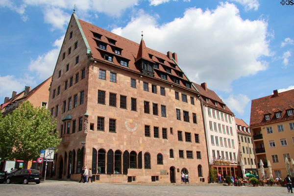 Medieval building with Virgin carving & sundial at Sebalder Platz. Nuremberg, Germany.
