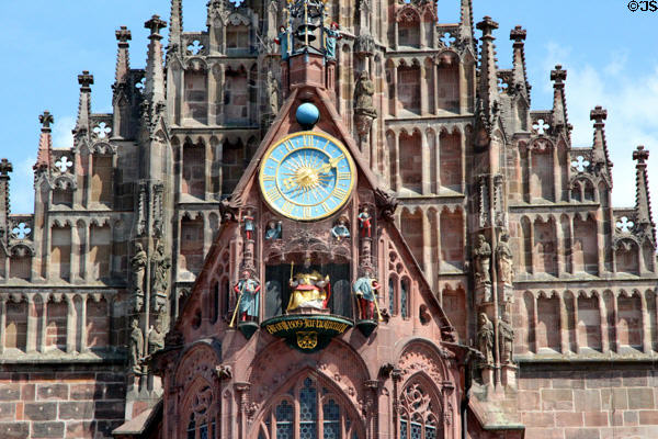 Männleinlaufen mechanical clock (1506-9) with seated Holy Roman Emperor on facade of Frauen Kirche. Nuremberg, Germany.