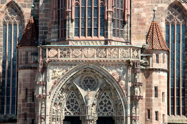 Central porch (1509) flanked by two stair towers decorated with saints & heraldic shields on Frauen Kirche. Nuremberg, Germany.