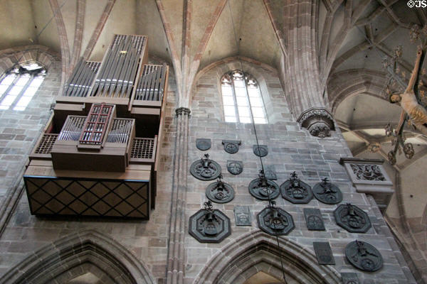 Organ pipes & memorial plaques in St. Lawrence Church. Nuremberg, Germany.