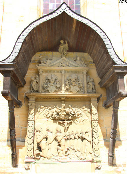 External devotional sculpture under wooden canopy at Gößweinstein pilgrimage basilica. Gößweinstein, Germany.