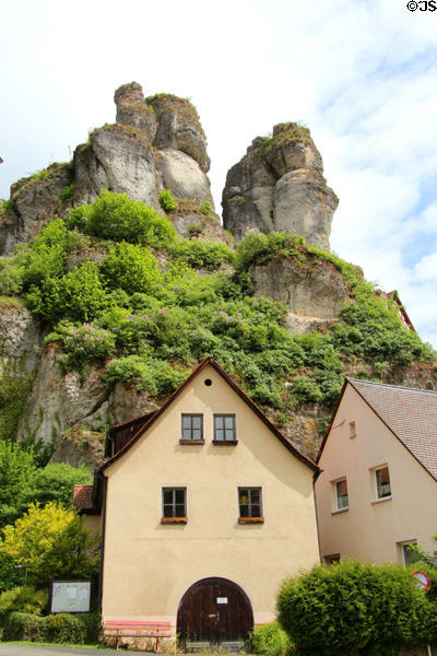 Tüchersfeld house sit among rock formations formed by reef during Jurassic era. Tüchersfeld, Germany.