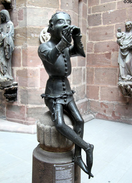 So-called Hansel fountain cast brass figure of flute player in Medieval doublet & pointed shoes (c1380) from Nuremberg at Germanisches Nationalmuseum. Nuremberg, Germany.