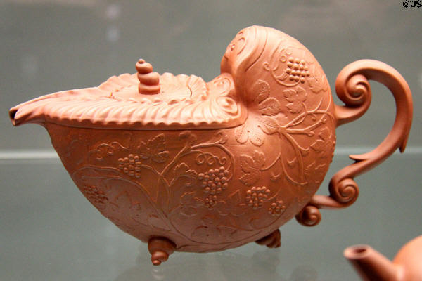 Red Böttger stoneware teapot in shape of nautilus shell (c1710-5) by Meissen at Germanisches Nationalmuseum. Nuremberg, Germany.