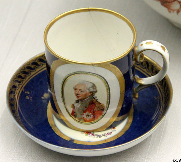 Porcelain coffee cup painted with wigged German in military uniform (c1775) from Ansbach at Germanisches Nationalmuseum. Nuremberg, Germany.