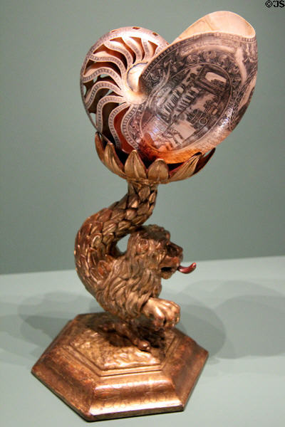 Nautilus shell engraved in Netherlands with entry of Gustav Wilhelm of Imhoff into Batavia (now Jakarta Indonesia) on wooden lion stand carved in Nuremberg (c1743) at Germanisches Nationalmuseum. Nuremberg, Germany.