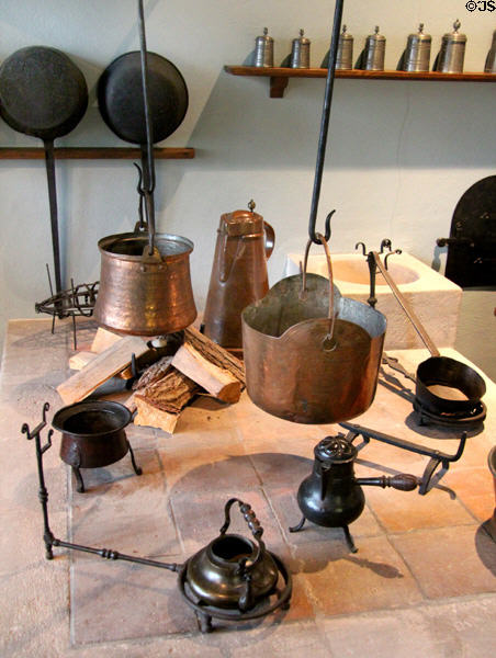 Metal kitchen cooking vessels at Fembohaus City Museum. Nuremberg, Germany.