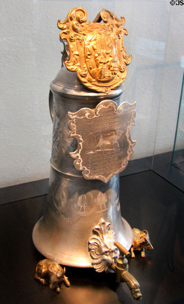 Butcher guild tin grinding flagon with spigot used for guild graduation of apprentices as journeymen (Schleifkanne) (1683) by Caspar Wandel at Fembohaus City Museum. Nuremberg, Germany.