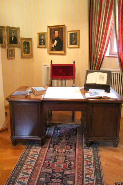 Office desk & Tucher family portraits at Tucher Mansion Museum. Nuremberg, Germany.